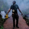 A grounds keeper at Pinecrest Gardens in Miami uses a blower to spray pesticide to kill mosquitoes as the number of Zika cases originating in Florida continues to rise. (Photo: Gaston De Cardenas/Miami Herald/TNS/Newscom)