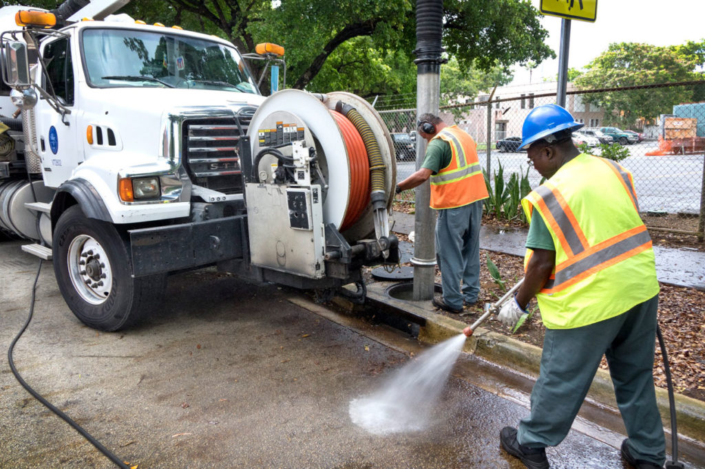 Workers Miami work diligently to clean the sewer systems as part of efforts to stop the spread of the Zika virus. (Photo: EPA/Cristobal/Herrera/Newscom)
