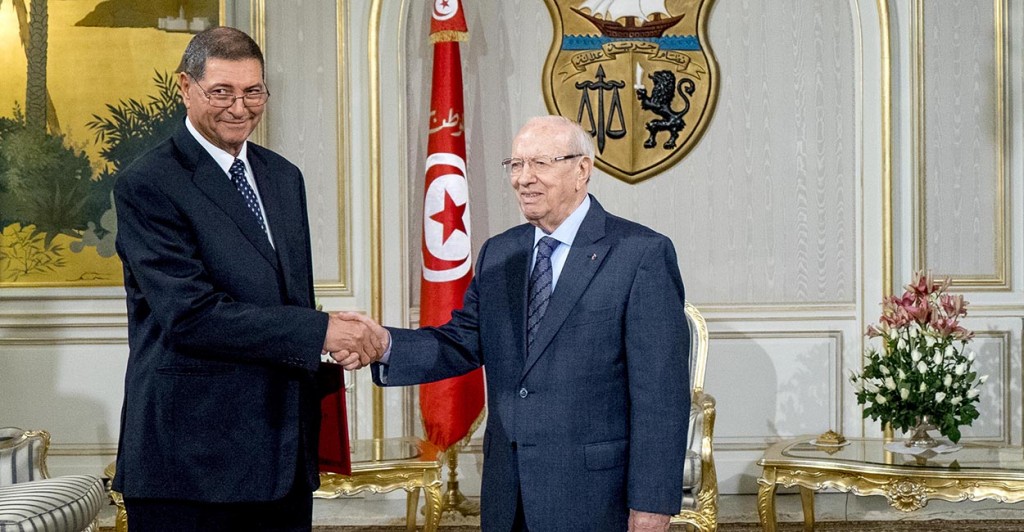 Tunisian President Beji Caid Essebsi shakes hands with prime minister designate Habib Essid during a meeting at the Carthage Palace in the capital Tunis, Tunisia. (Photo: Nicolas Fauque/Images de Tunisie/Newscom)