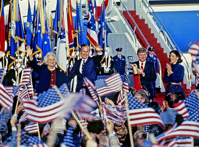 United States President-elect George H.W. Bush and Vice President-elect Dan Quayle return to Andrews Air Force Base, just outside Washington, D.C. after winning the 1988 Presidential Election on November 9, 1988.  From left to right: Barbara Bush, President-elect Bush, VP-elect Quayle, and Marilyn Quayle. (Photo: Ron Sachs/CNP/AdMedia)