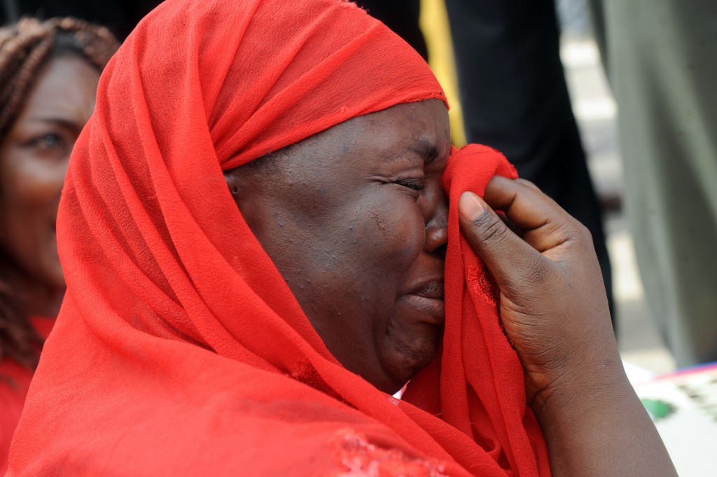 One of the mothers of the missing Chibok school girls wipes her tears as she cries during a rally by civil society groups pressing for the release of the girls in Abuja. (Photo: Getty Images/Newscom)