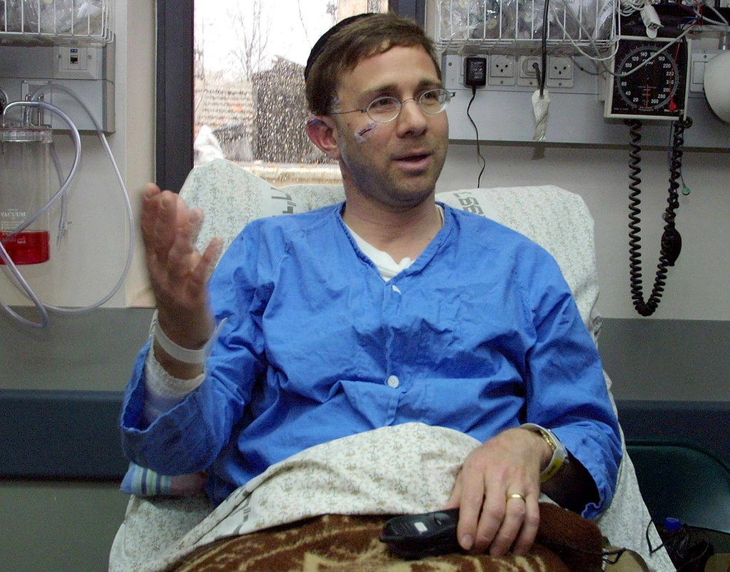Mark Sokolow in a hospital bed in Jerusalem January 28, 2002. Sokolow, 43, a survivor of the September 11 attack on New York's World Trade Center, was a victim to another bombing attack on the junction of Jaffa Road and King George Street in west Jerusalem  in which some 40 people were injured and two killed. (Photo: Menahem Kahana/Newscom)