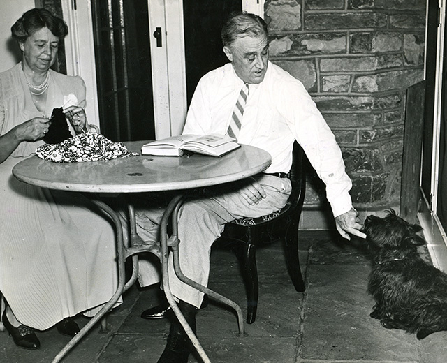 Former President Franklin D. Roosevelt and his wife Eleanor with their Scotch terrier Fala on the terrace of his house in Hyde Park, New York. (Photo: Newscom)
