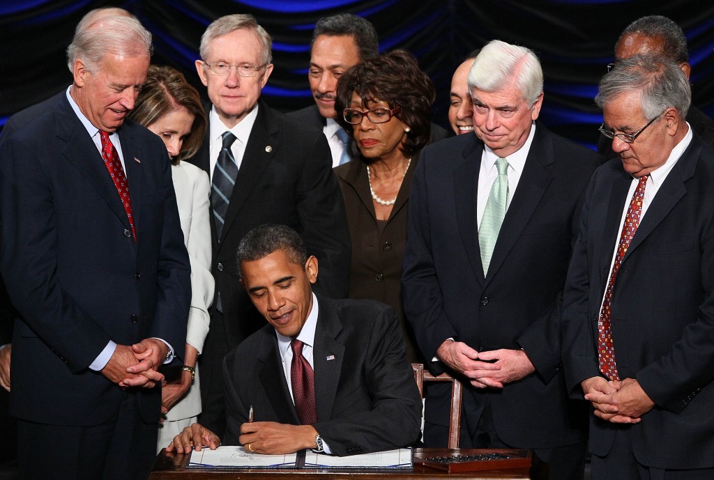 Obama signs Dodd-Frank in 2010. (Photo by OwenDB/Black Star)