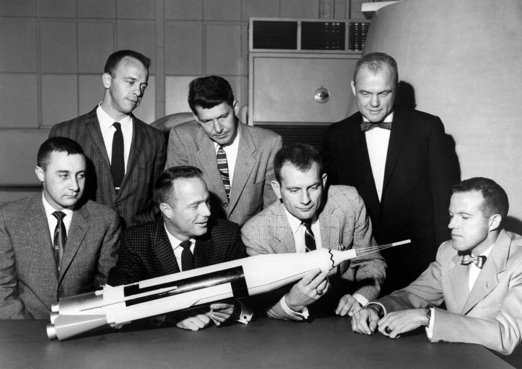 The Original 7 Mercury Astronauts are pictured around a table admiring an Atlas model. The Mercury 7 astronauts were introduced to the American public in April 1959. (Photo: NASA via CNP/Newscom)