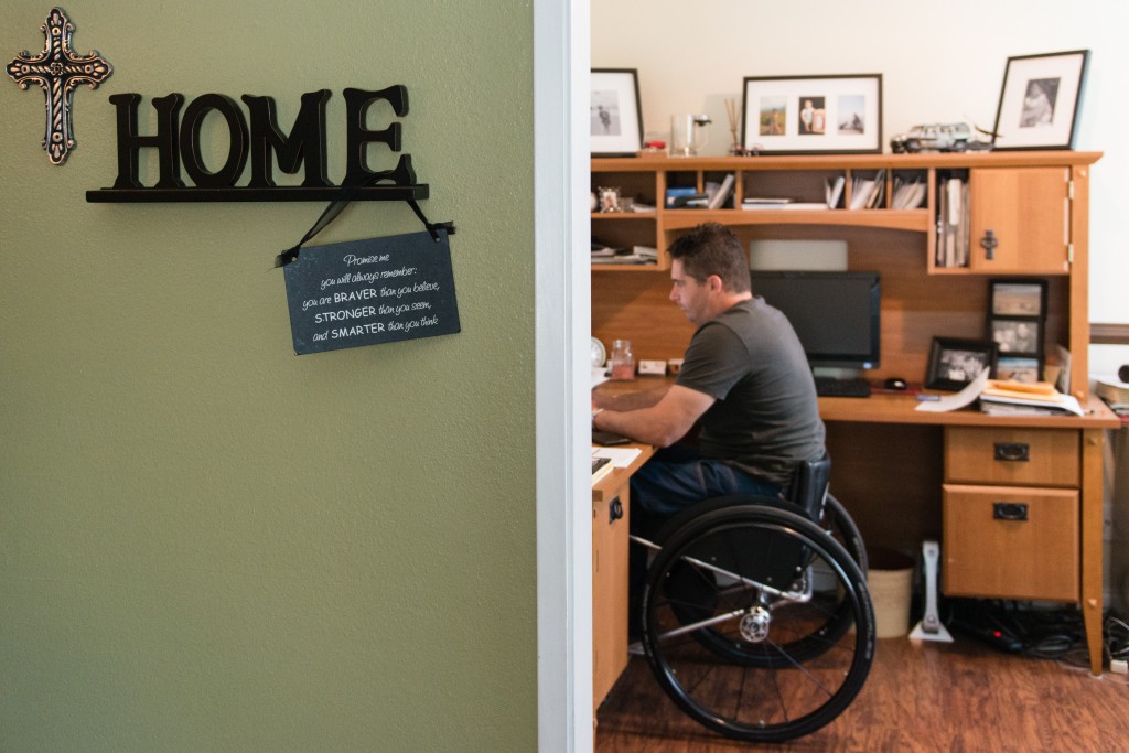 Anthony R. Orefice, 40, owns a medical supply business and works from home. Orefice says his faith helped him get through the initial depression of being paralyzed. (Photo: Heidi de Marco/KHN)