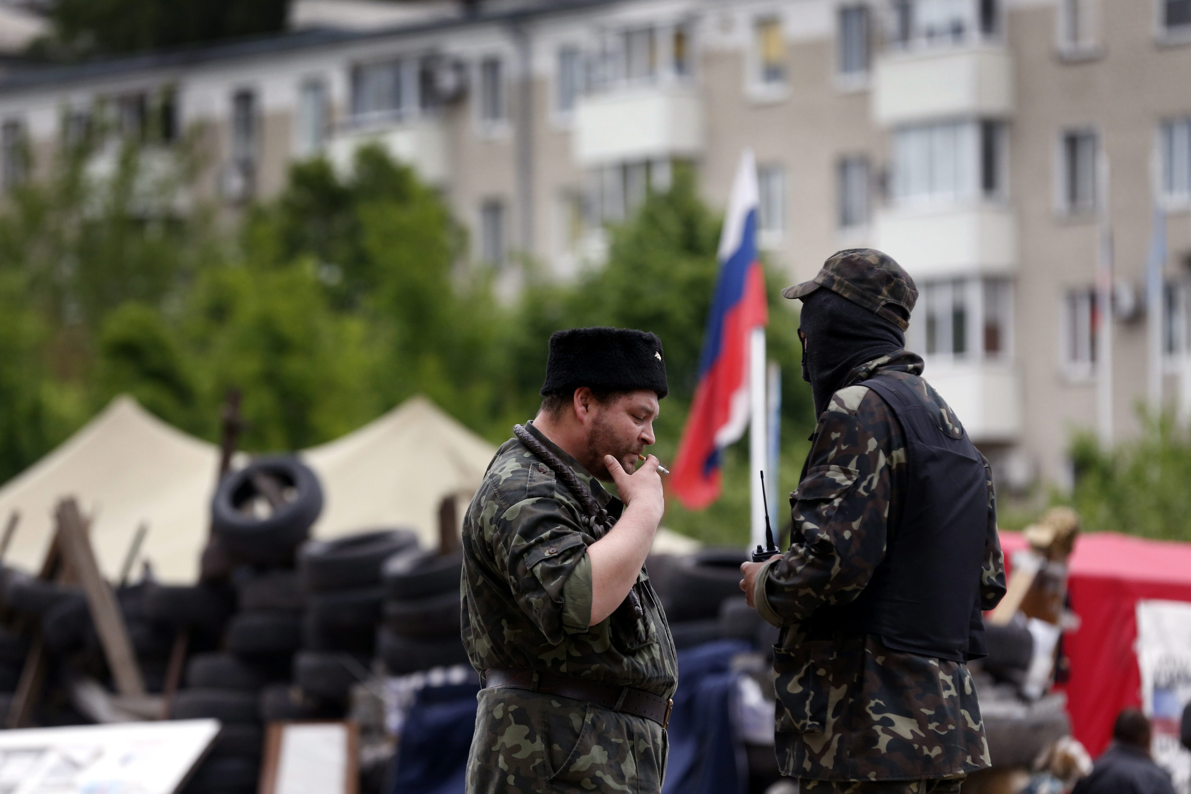 Supporters of the self-declared Donetsk People's Republic stand in front of the occupied regional administration building in Donetsk, Ukraine, May 12, 2014. (Photo: Maxim Shipenkov/Newscom)