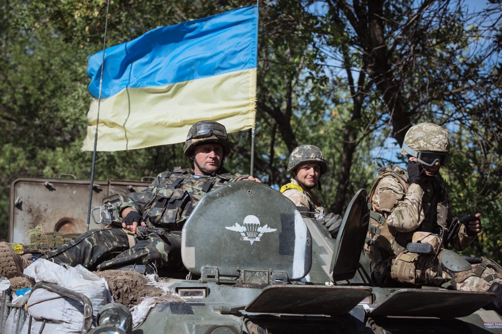 Ukrainian soldiers drive on an Armored Personnel Carrier on a road near a military camp in Kramatorsk town, near Slaviansk, Ukraine, Sept. 4, 2014. NATO and Russia set themselves on a collision course as leaders attended a summit in Wales to ramp up support from the trans-Atlantic alliance in the fight against eastern separatists, provoking angry responses from Moscow. The summit was overshadowed by Russia's annexation of Crimea in March and five months of fighting between pro-Russian separatists and government forces in eastern Ukraine. (Photo: Roman Pilipey/Newscom)