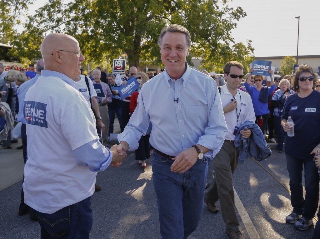 Georgia Republican Senate candidate David Perdue arrives for a campaign rally before a debate at the Georgia National Fair (Photo: Newscom)