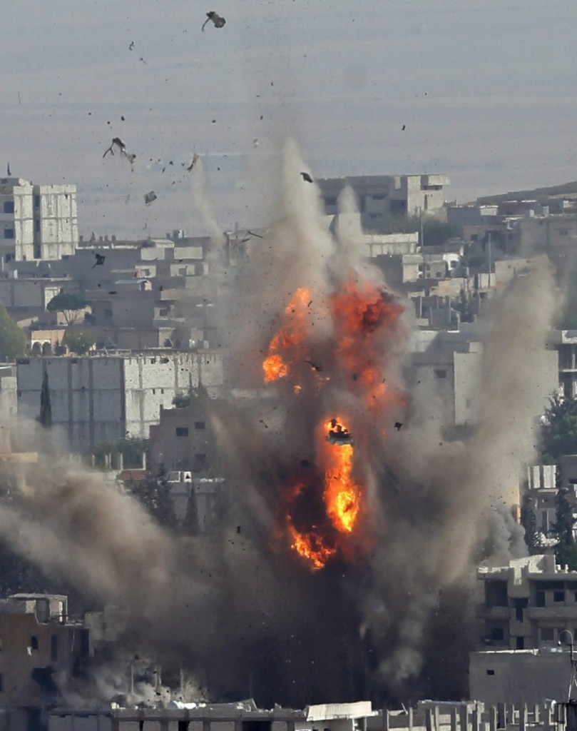 Smoke rise after US-led coalition airstrike on Kobane, Syria. (Photo: Tolga Bozoglu/Newscom)