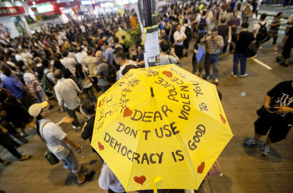 Pro-democracy protesters gather to discuss politics in the street in Mong Kok, Kowloon, Hong Kong, China. (Photo: Newscom)