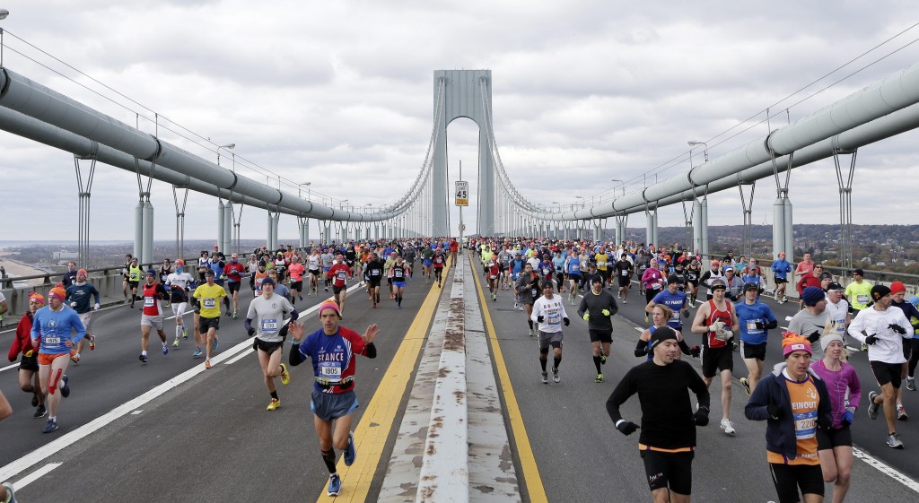 he first wave of runners make their way across the Verrazano Bridge at the start of the 2014 New York City Marathon. (Photo: Andrew Gombert/Newscom)