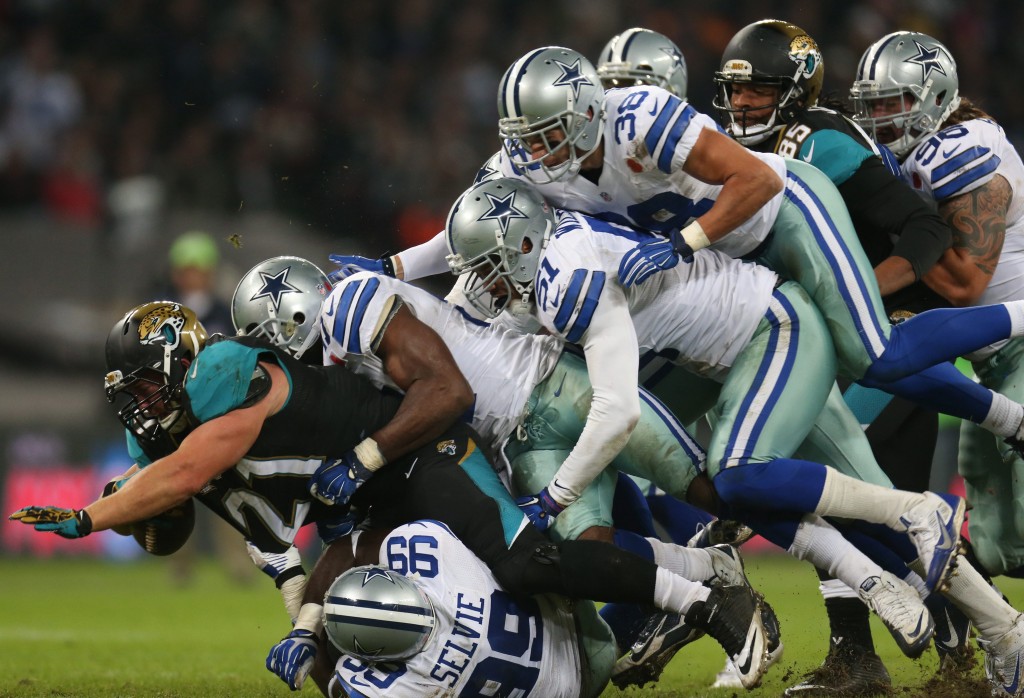 Jacksonville Jaguars player Toby Gerhart is tackled by the Dallas Cowboys during the NFL American Football game at Wembley Stadium in London. (Photo: Newscom)