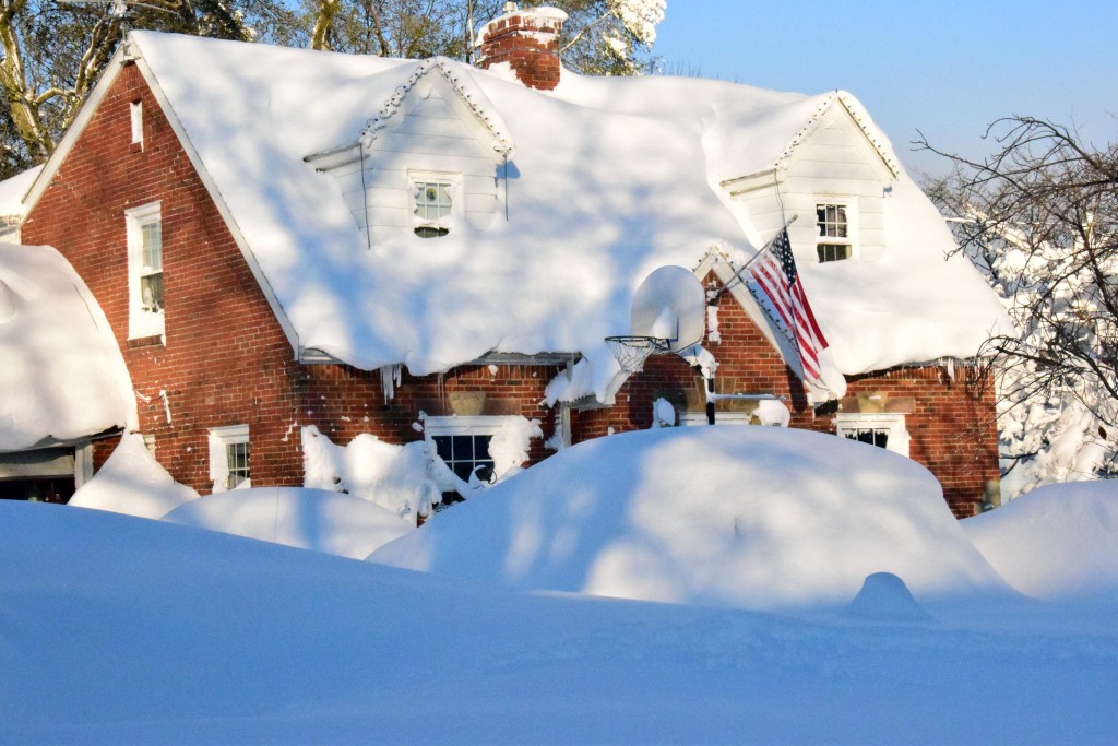 A home is covered in snow in a neighborhood just south of Buffalo. (Photo: Newscom)