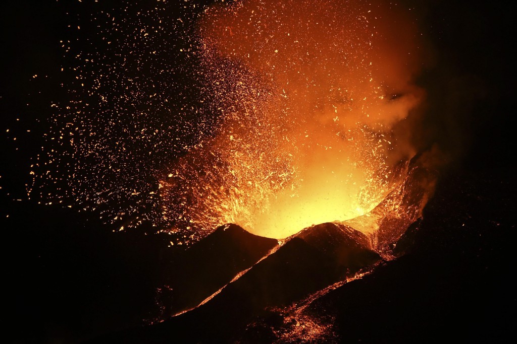 Hot lava and clouds of smoke and gases spew from a volcano opening on the island of Fogo, near Cha das Caldeiras, Cape Verde. (Photo: Joao Relvas/Newscom)
