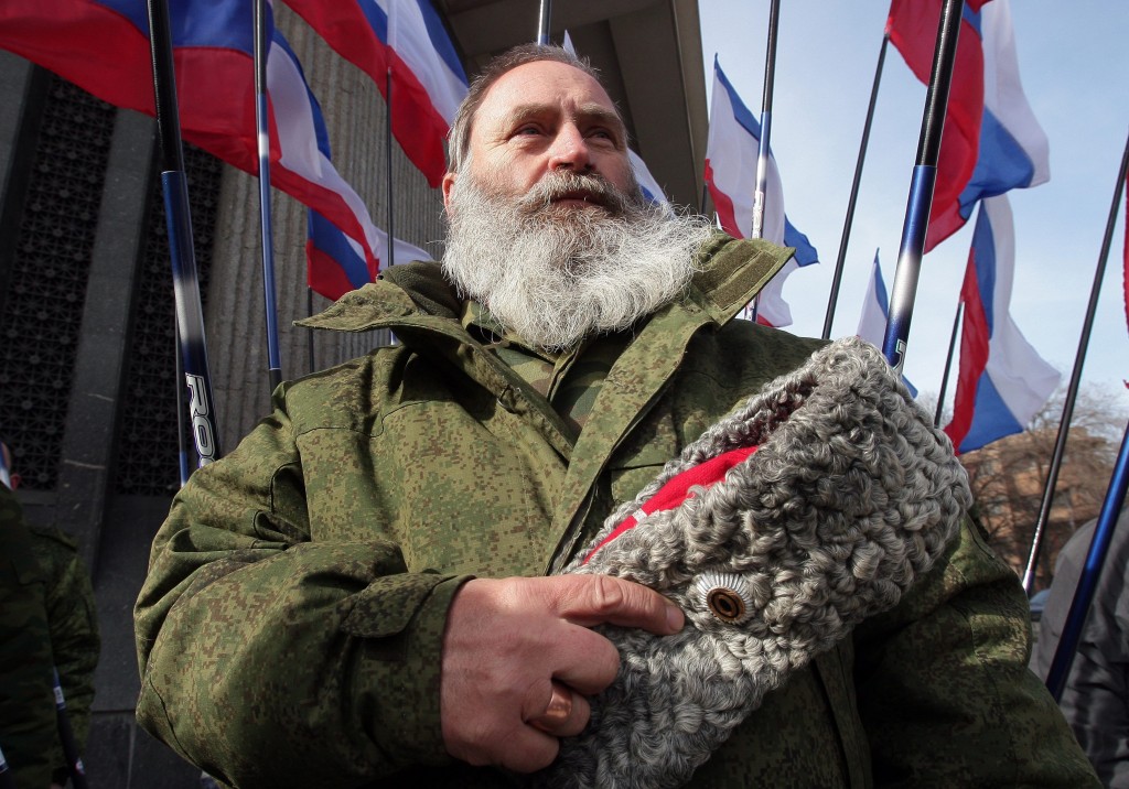 A cossack attends a rally to mark  anniversary of controversial referendum to join Russia, in Simferopol, Crimea, March 16, 2015. (Photo: Artur Schvarts/Newscom)