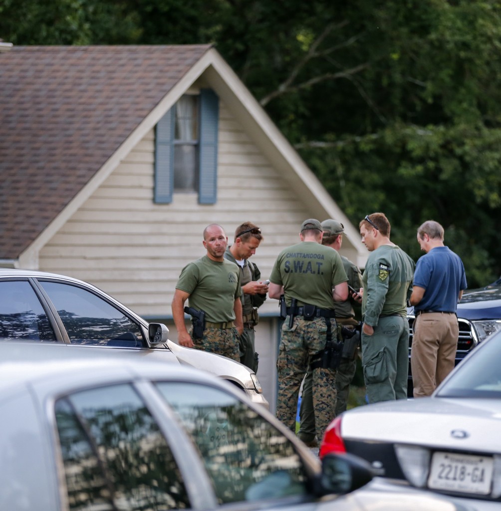 Law enforcement personnel gather outside the home of gunman Mohammod Youssuf Abdulazeez to search for a potential motive. (Photo: Erik S. Lesser/EPA/Newscom)