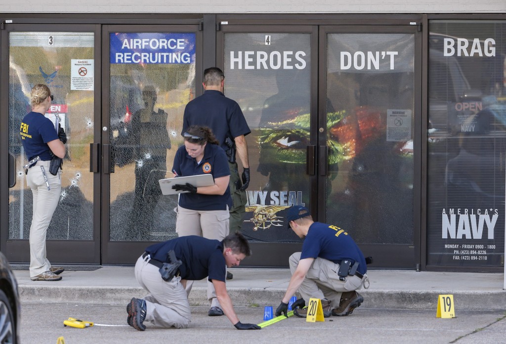 epa04849745 Members of a Federal Bureau of Investigations (FBI) Evidence Response Team work outside a US Military Recruiting storefront after a shooting in Chattanooga, Tennessee, USA, 16 July 2015. Authorities say the shootings at two different locations left four US Marines and the gunman Mohammod Youssuf Abdulazeez dead.  EPA/ERIK S. LESSER (Newscom TagID: epalive751951.jpg) [Photo via Newscom]