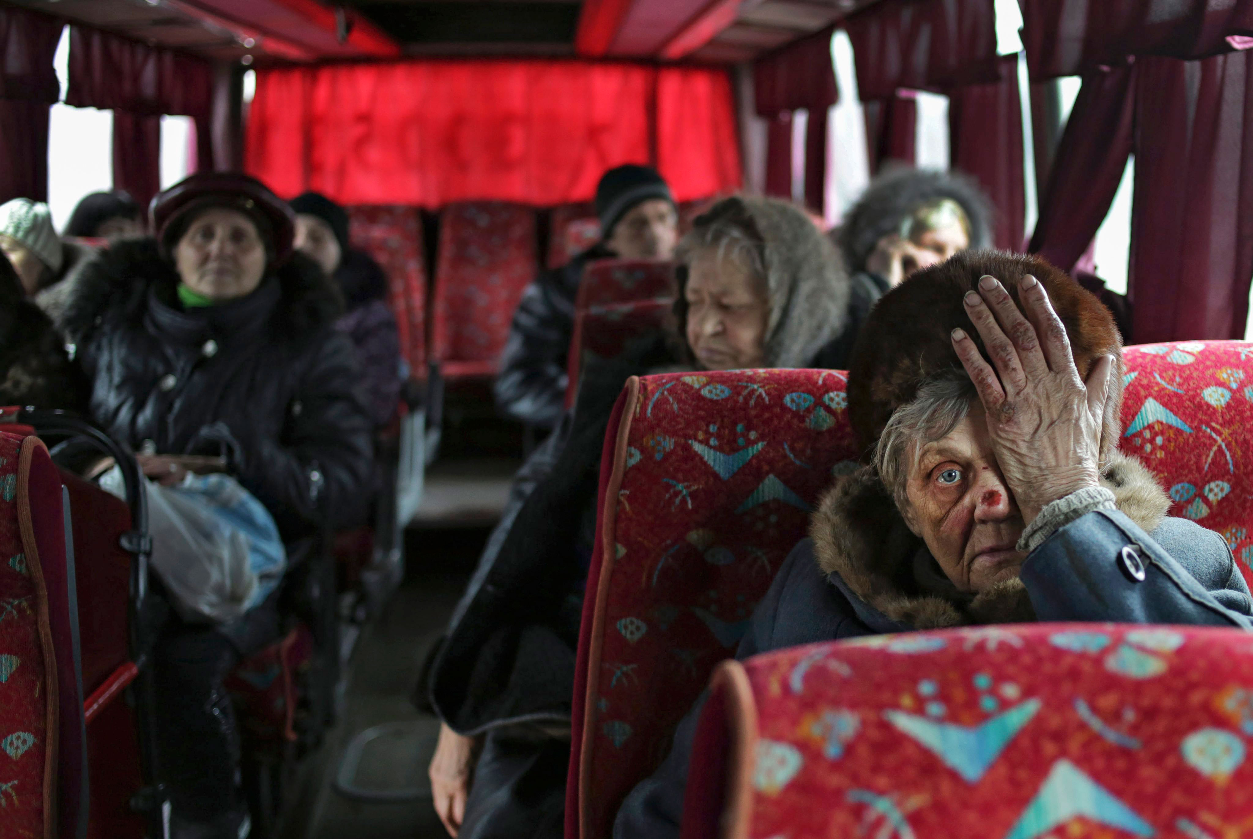 Local citizens sit in a bus as they wait to be evacuated from Debaltseve, Ukraine, Feb. 3, 2015. (Photo: Anastasia Vlasova/EPA/Newscom)