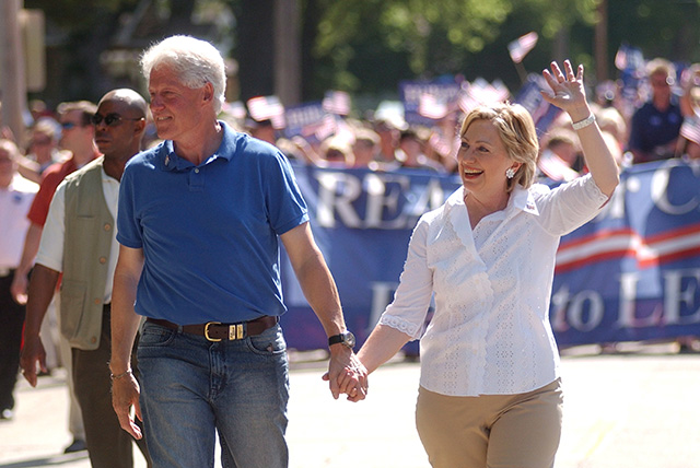 Bill and Hillary Clinton and her husband former president Bill Clinton, march in the Independence Day Parade in Clear Lake, Iowa, 04 July 2007. Photo: EPA/Steve Pope