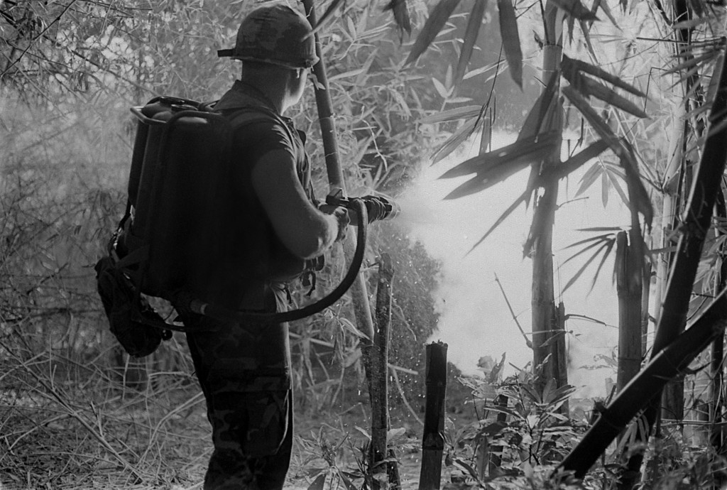 A U.S. soldier clears a jungle area with his flame thrower. May 22, 1970. (Photo: evhistorypix/Newscom)