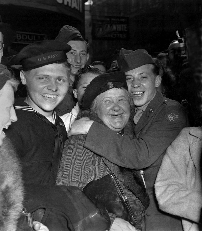 A jubilant American soldier hugs an English woman celebrating Germany’s unconditional surrender. (Photo: Newscom)