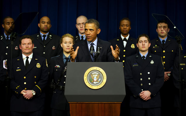 President Obama warns against sequestration with a backdrop of emergency responders. (Photo: JIM WATSON/AFP/Getty Images/Newscom)