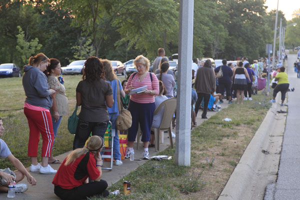 Hundreds wait in line for section 8 housing vouchers in Bloomington, Indiana, in July. (Photo: Polaris)
