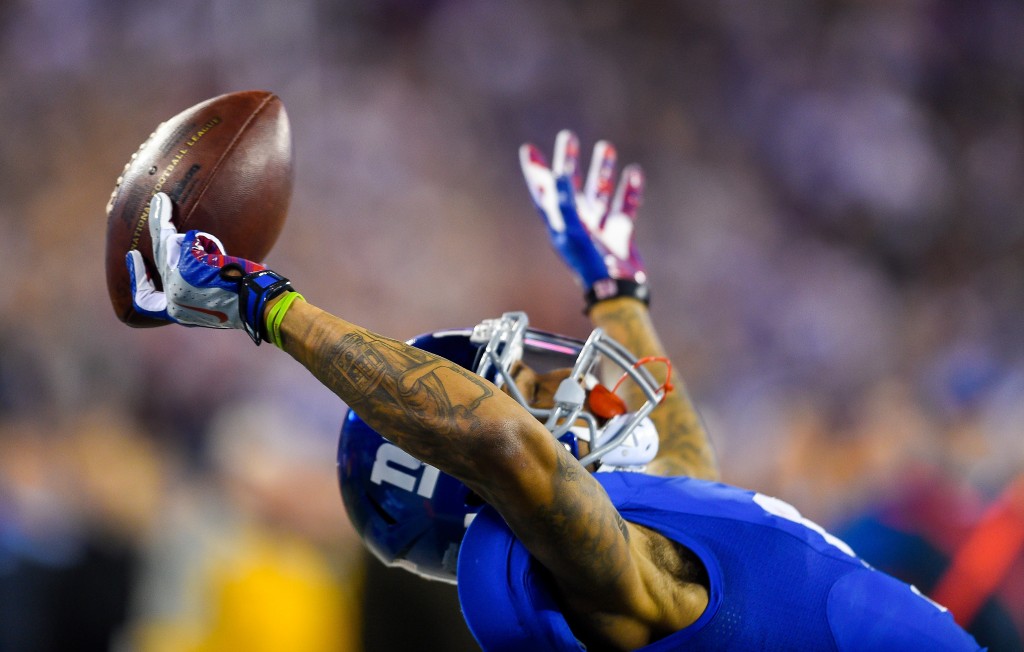 New York Giants wide receiver Odell Beckham makes a 43-yard touchdown catch during a NFL game between the Dallas Cowboys and New York Giants on Nov. 23. (Photo: Newscom)