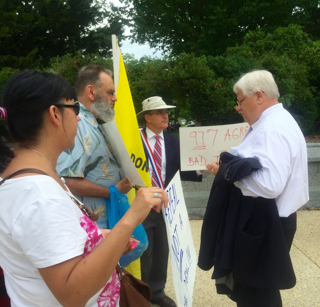 Protesters address their concerns with Obamacare to Rep. Kenny Marchant, R-Texas.