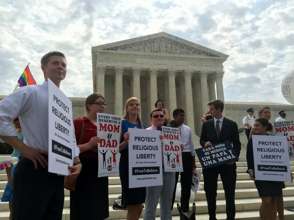 Traditional marriage advocates hold signs in front of the Supreme Court on Thursday, June 25. (Photo: Samantha Reinis/The Daily Signal)