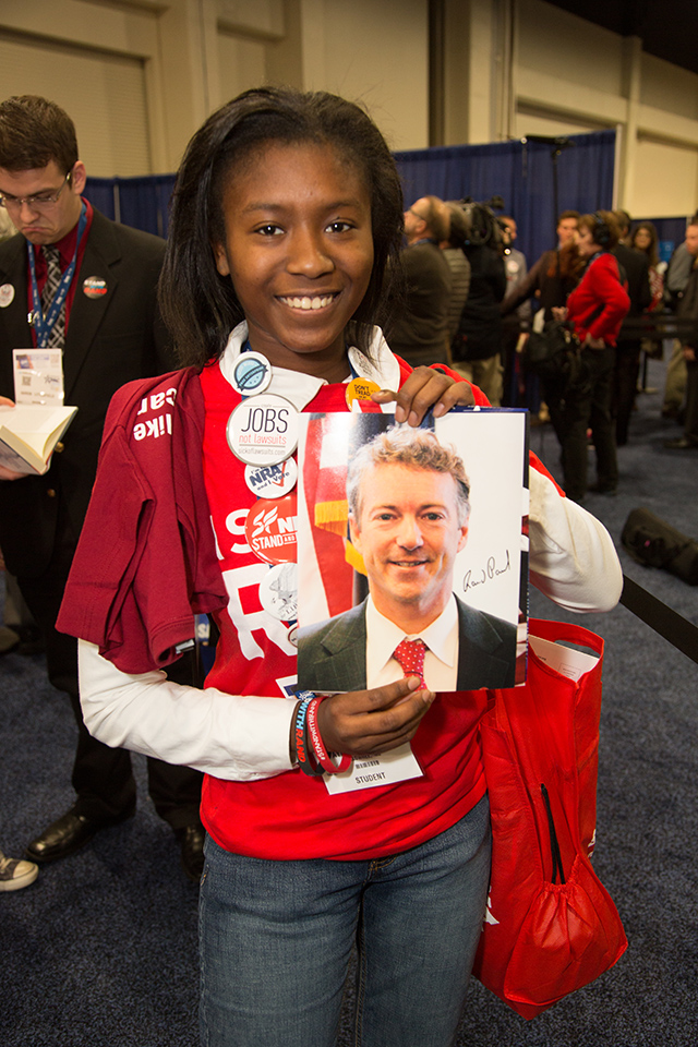 Young Rand Paul supporter Aylicia Stover from North Carolina holds an autographed photo of her favorite candidate at the 2014 Conservative Political Action Conference. (Photo: Jeff Malet/Newscom)
