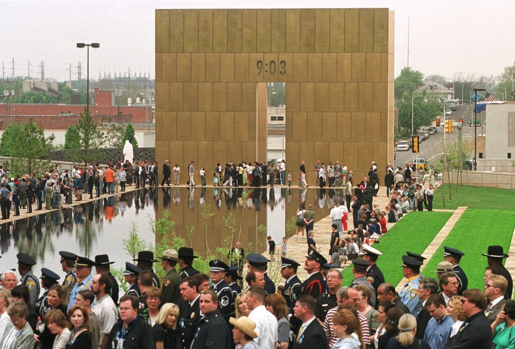 Participants and visitors to the Oklahoma City National Memorial gather around the reflecting pool on Wednesday, April 19, 2000 for a five-year memorial ceremony. (Photo: Horiz/Newscom)