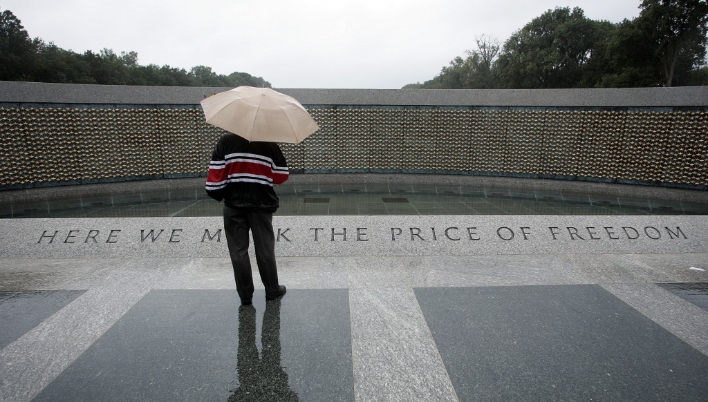 A veteran takes a quiet moment to honor his peers, Sept. 28. (Photo: Chuck Kennedy/Newscom)