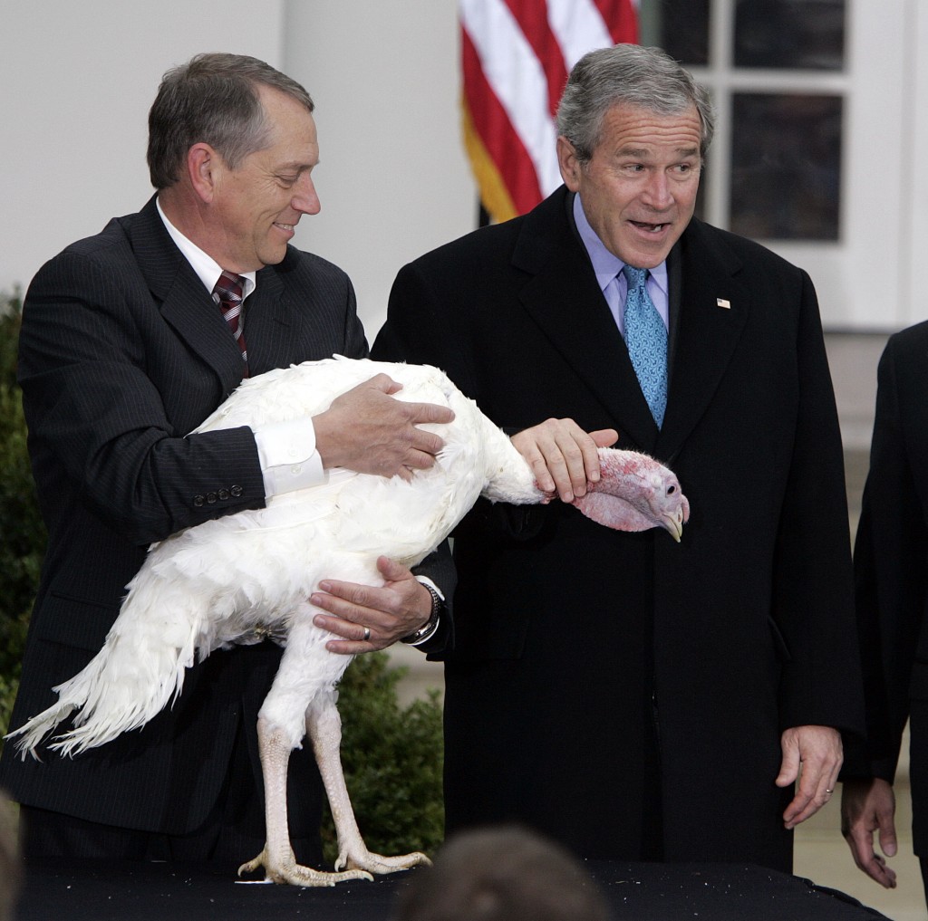 President George W. Bush pets Flyer the turkey in 2006. (Photo: Chuck Kennedy/Newscom)