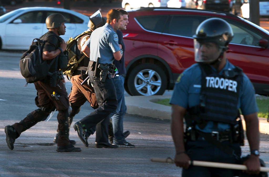 Huffington Post reporter Ryan J. Reilly is arrested trespassing when police officers  closed a Ferguson, Mo., McDonald's restaurant on West Florissant Avenue on Wednesday, Aug. 13, 2014. (Photo: Robert Cohen/St. Louis Post-Dispatch/MCT)