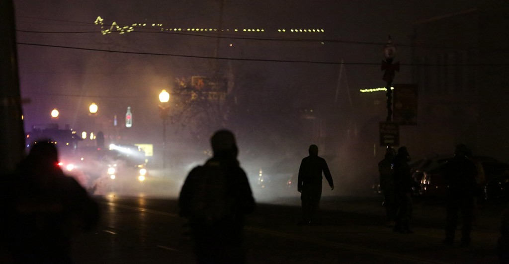 The streets of Ferguson, Mo. were dark and loud all night long after the grand jury made its announcement. (Photo: Armando Sanchez/Newscom)