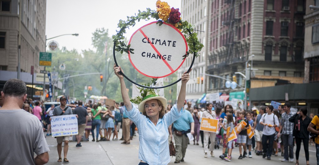 A woman holds a sign against climate change in Midtown Manhattan in New York on Sept. 21, 2014, while taking part in the People's Climate March calling for action against climate change. (Photo: Richard B. Levine/Newscom)