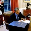 President Barack Obama signing the Consolidated Appropriations Act in the Oval Office on Dec. 18, 2015. (Photo: Olivier Douliery Pool /CNP/Newscom)
