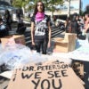 Cassandra Williams, a student union member at the University of Toronto, poses in front of sign at a free speech protest centered on professor Jordan Peterson. (Photo: Vince Talotta/Toronto Star/Newscom)