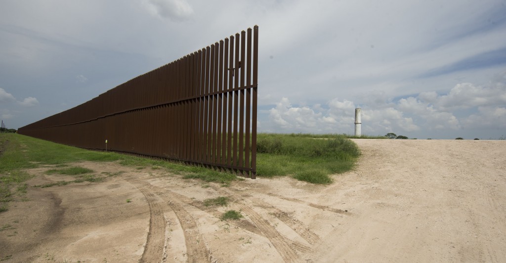 The border wall runs several miles through a rural area east of Brownsville. (Photo: Bob Daemmrich/Newscom)