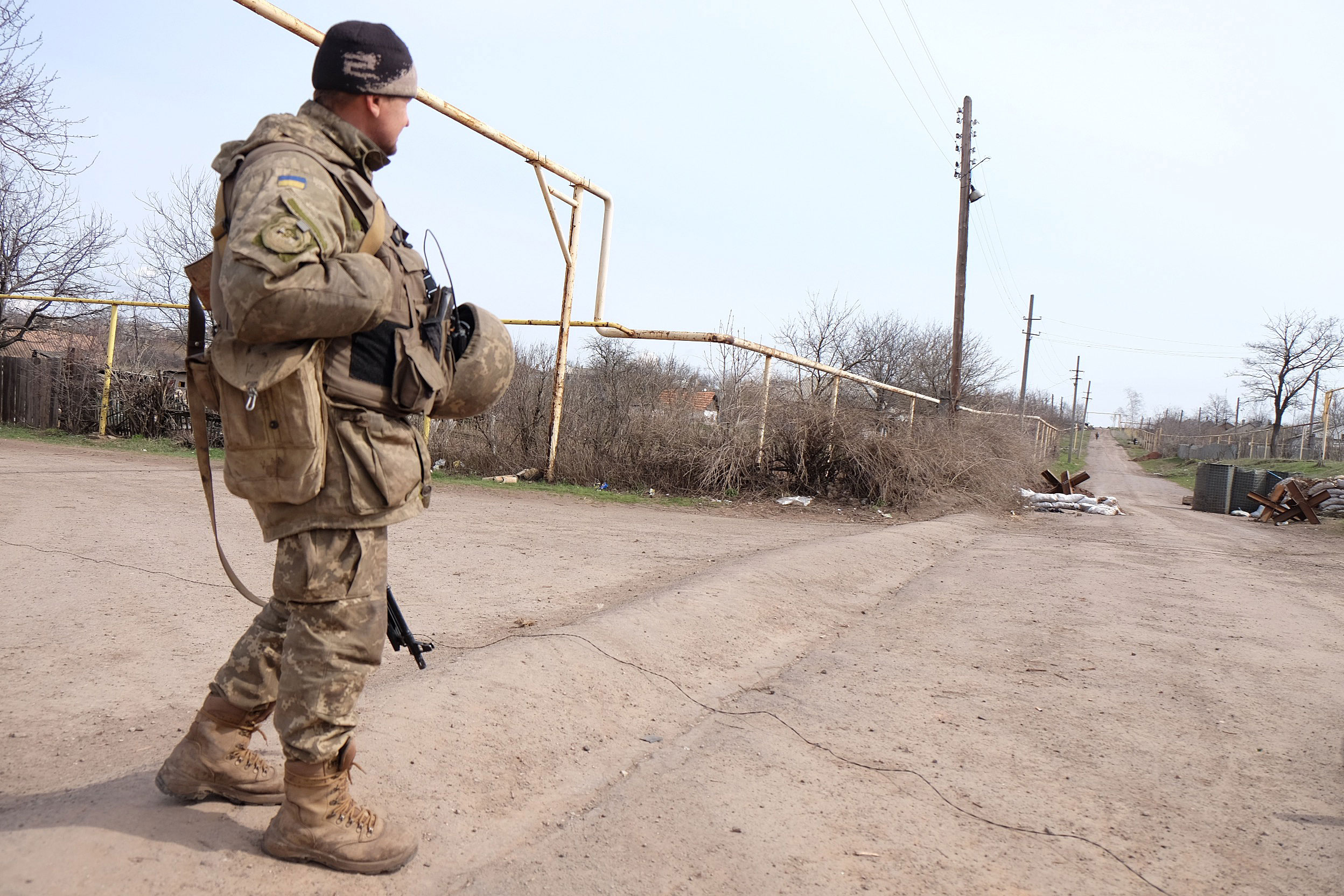 A Ukrainian soldier walks on the front lines in front of separatist positions, Zaitseve, Ukraine, April 4, 2016. (Photo: Jonathan Alpeyrie/Polaris/Newscom)