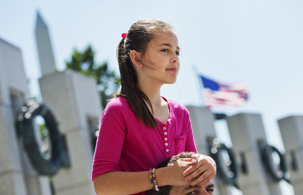 Addie Pearce, 9, honors the lives lost in World War II at a ceremony to mark the 70th anniversary of D-Day. (Photo: Tom Williams/CQ Roll Call) 