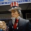 A tall statue representing Uncle Sam stands outside a tax preparation office. (Photo: Anthony Behar/Sipa USA)