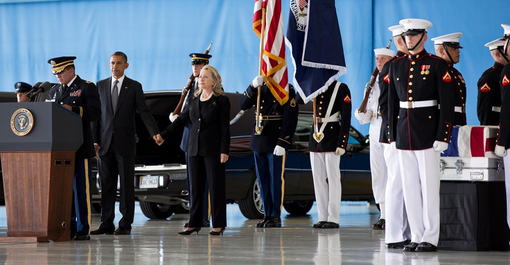 President Obama and Hillary Clinton after his remarks during the ceremony at Joint Base Andrews, marking the return to the United States of the remains of J. Christopher Stevens, U.S. Ambassador to Libya; Sean Smith, Information Management Officer; and Security Personnel Glen Doherty and Tyrone Woods, who were killed in the attack on the U.S. Consulate in Benghazi, Libya. (Photo: Pete Souza/White House/Sipa Press)