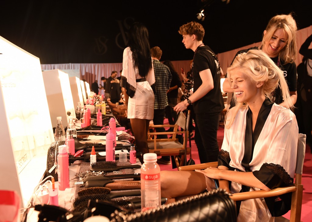 Backstage hair and makeup. (Photo: Newscom)