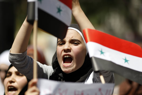 A Syrian living in Turkey shouts slogans during a protest against the government of Syria's President Bashar al-Assad after Friday prayers in front of the Syrian consulate in Istanbul August 19, 2011. REUTERS/Osman Orsal 