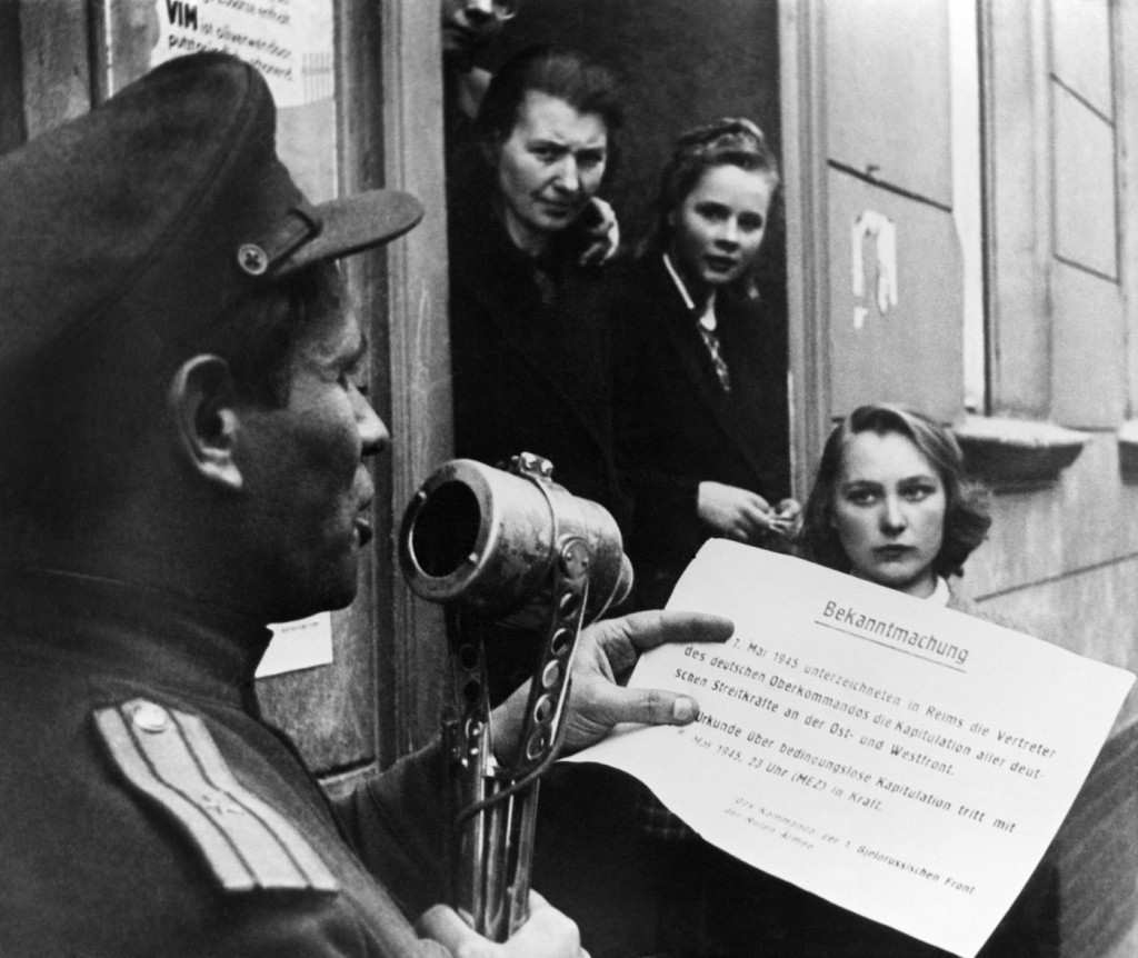 A Soviet officer reads the text of the German instrument of surrender. (Photo: TASS/Valery Faminsky/Newscom)