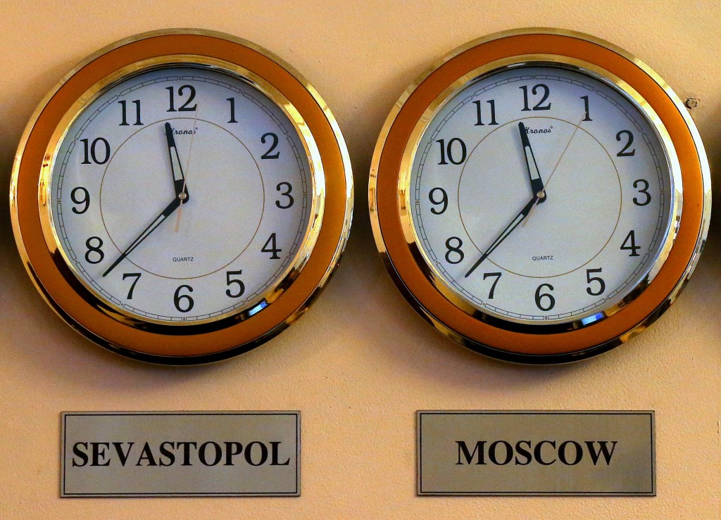Clocks show the time in Sevastopol and Moscow on March 29, 2014. Crimea officially moved to the Moscow time zone one year ago. (Photo: Alexander Ryumin/Newscom)