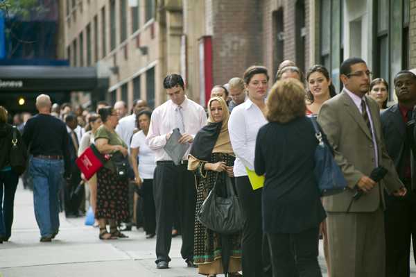 Job seekers line up for a job fair in midtown in New York on Monday, August 15, 2011. (Frances M. Roberts)